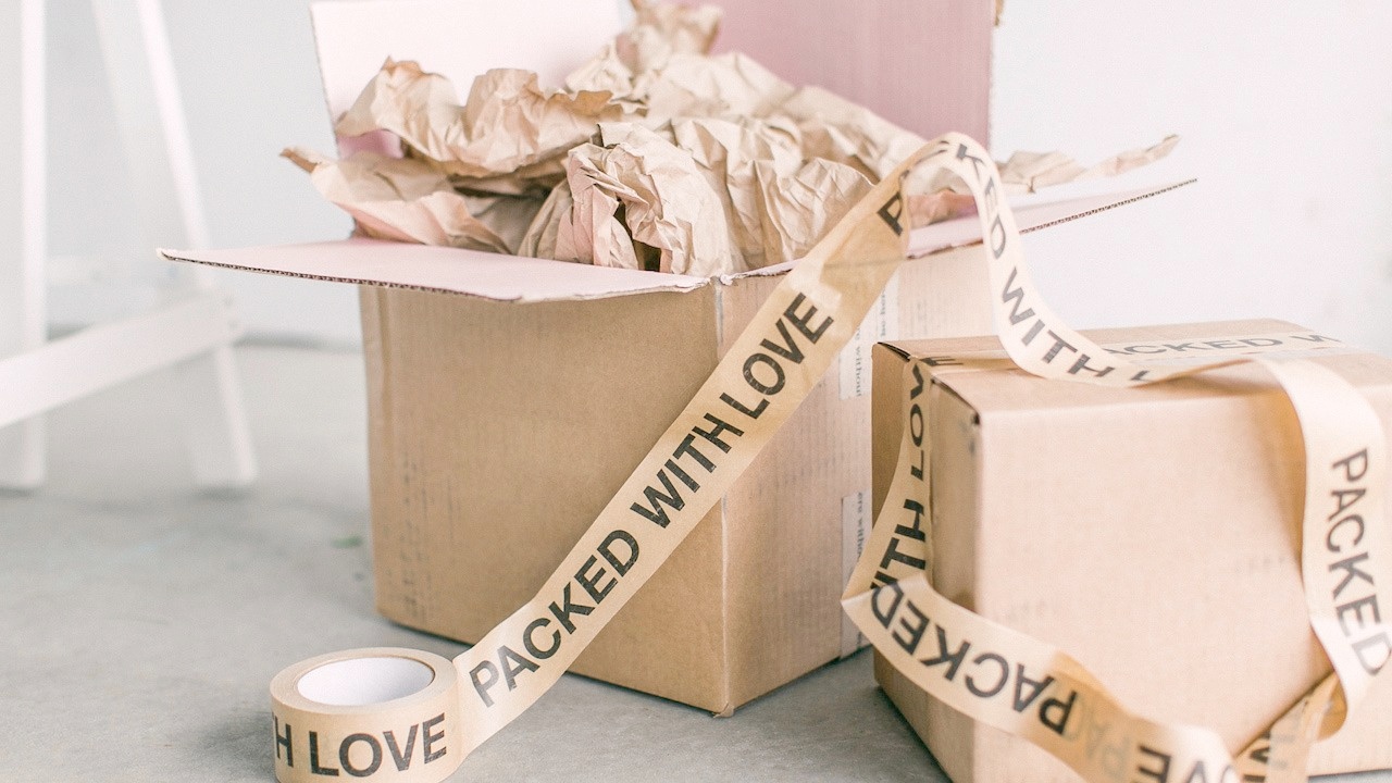 Image of box packed with love (How to Start a Subscription Box by Moira Fuller Business Coach)