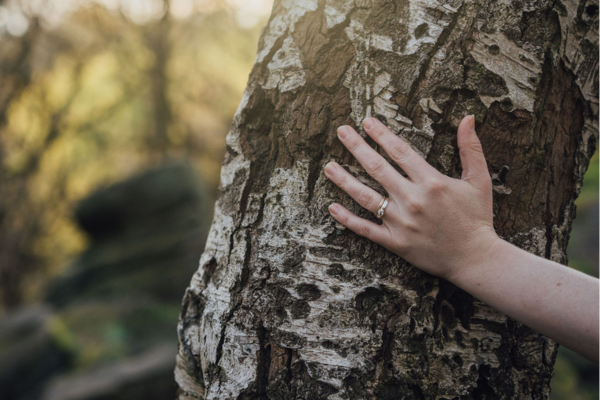 Moira writing on a notepad